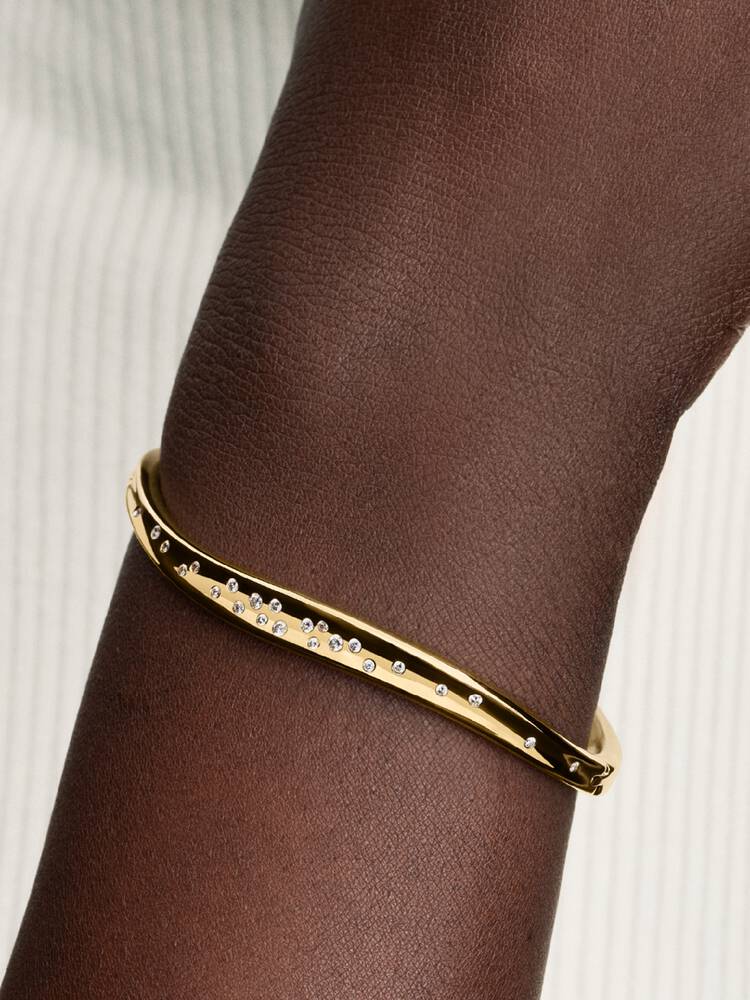 Bracciale Rigido Ondulato con Pietre Incastonate Finitura Oro